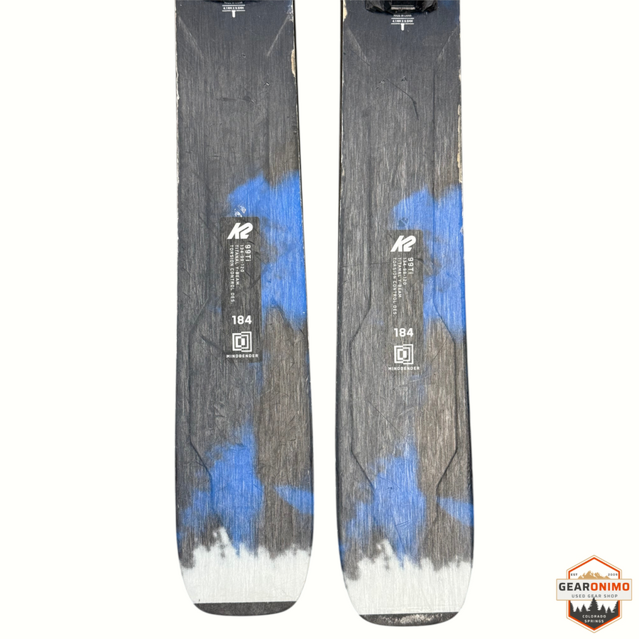 Gearonimo Sports K2 Mindbender 99ti skis in 184cm length with blue and grey graphic design and Salomon M11 bindings
