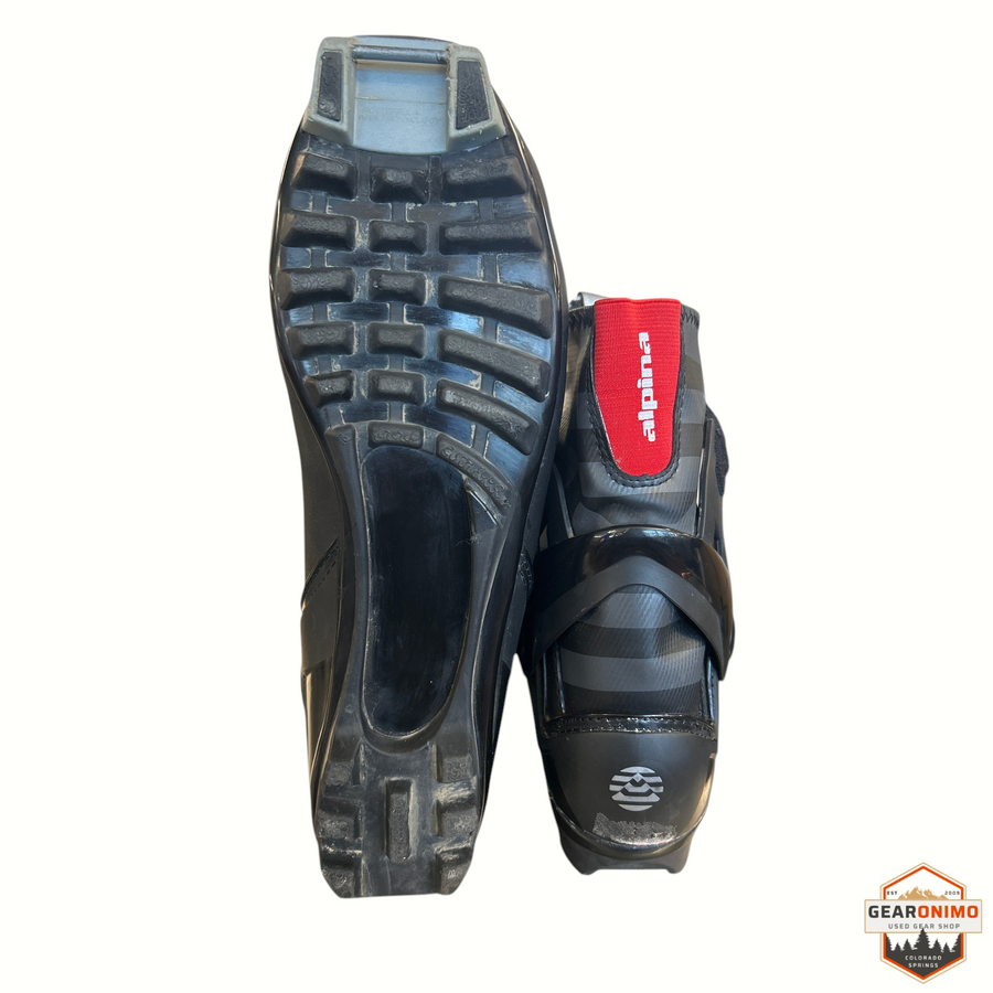 Gearonimo Sports Alpina T-20 Plus touring NNN cross-country ski boots in black with red accents, bottom view