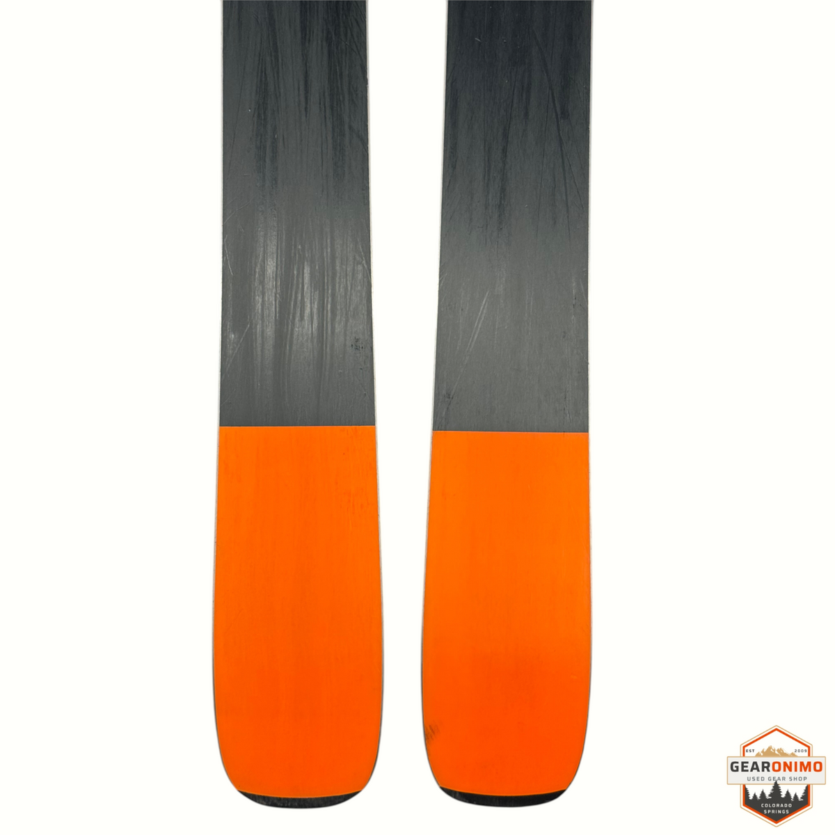 Gearonimo Sports Blizzard Black Pearl 88 skis with a black and orange base design, shown from the tail view.