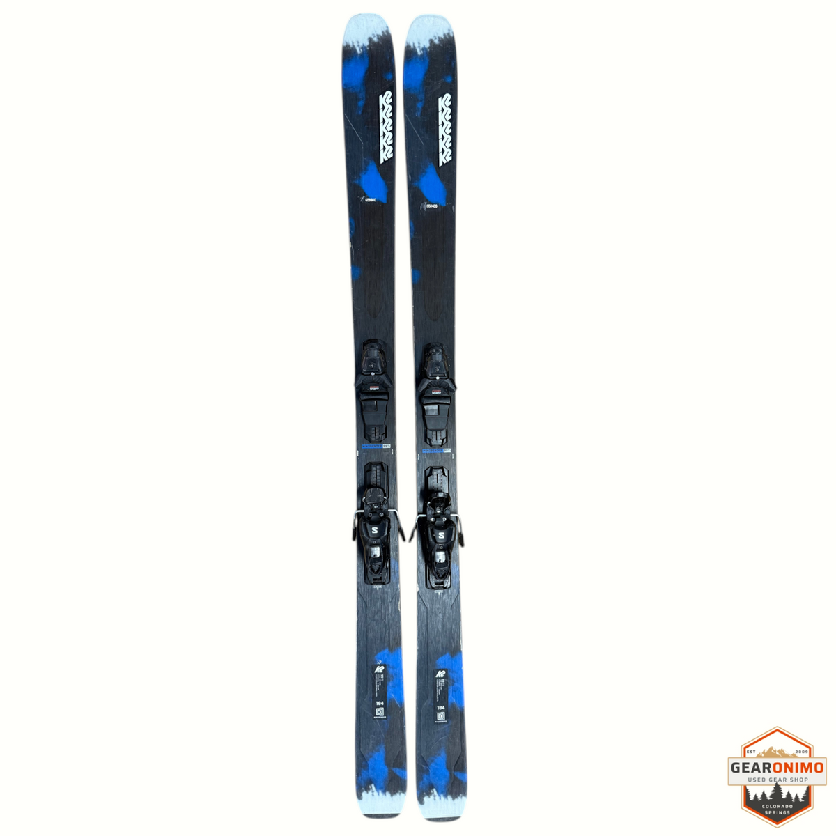 Gearonimo Sports K2 Mindbender 99ti skis with Salomon M11 bindings, featuring a blue and black graphic design.