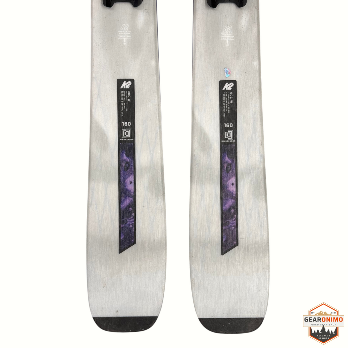 Gearonimo Sports K2 Mindbender 90c W skis in 160cm length with purple spectral braid detail on silver topsheet
