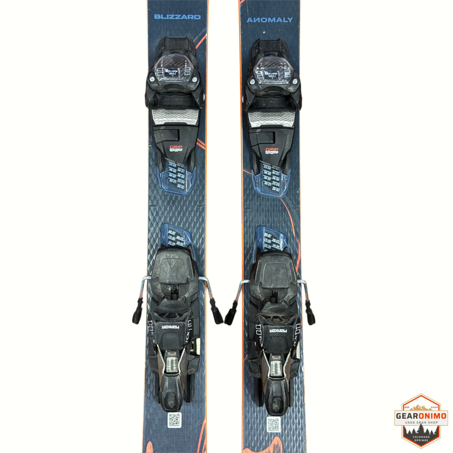 Gearonimo Sports Blizzard Anomaly 94 skis in dark grey with orange accents and mounted Salomon M11 bindings