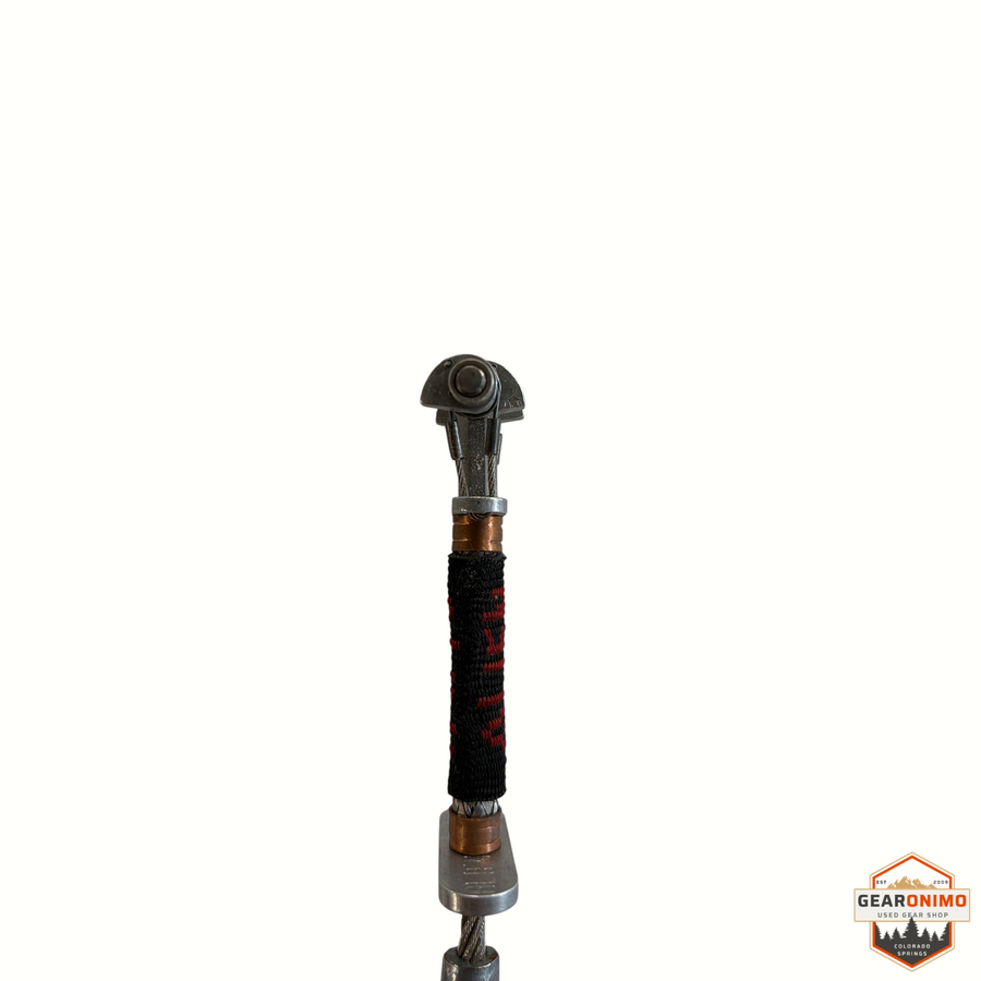 Gearonimo Sports blue Alien Cam climbing protection device with a flexible stem and black and red textile wrap