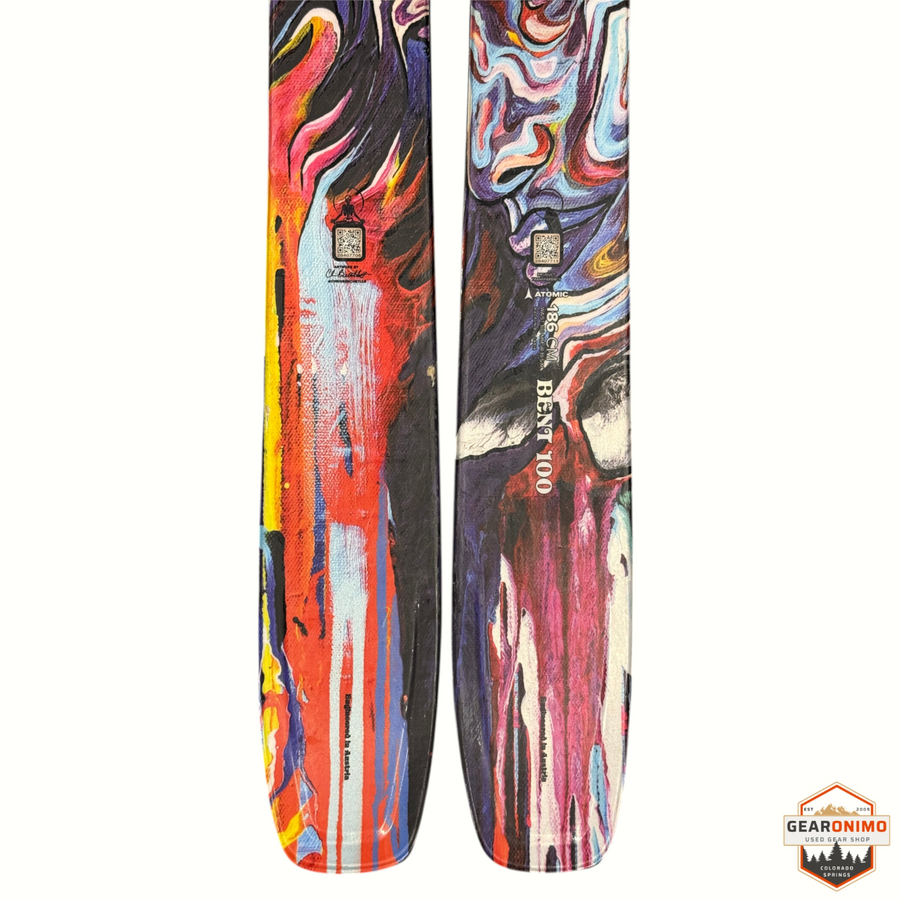 Gearonimo Sports Atomic Bent Chetler 100 skis featuring vibrant abstract multi-colored graphic design, size 186cm