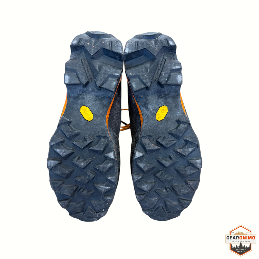 Gearonimo Sports La Sportiva Aequilbrium Trem GTX hiking boots showing the black Vibram lugged outsoles from below