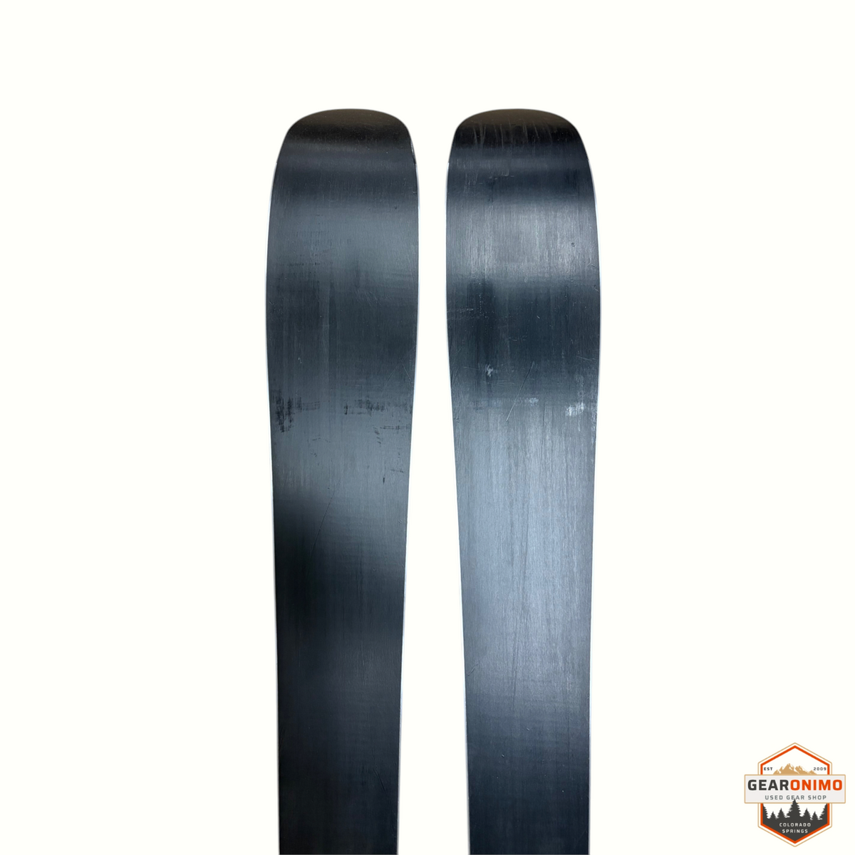 Gearonimo Sports Armada Arv 143cm skis featuring a smooth black base surface for alpine skiing