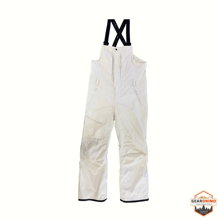 Gearonimo Sports Trew Gear Jefferson snow bibs in off-white with black adjustable suspenders and front zip pockets.