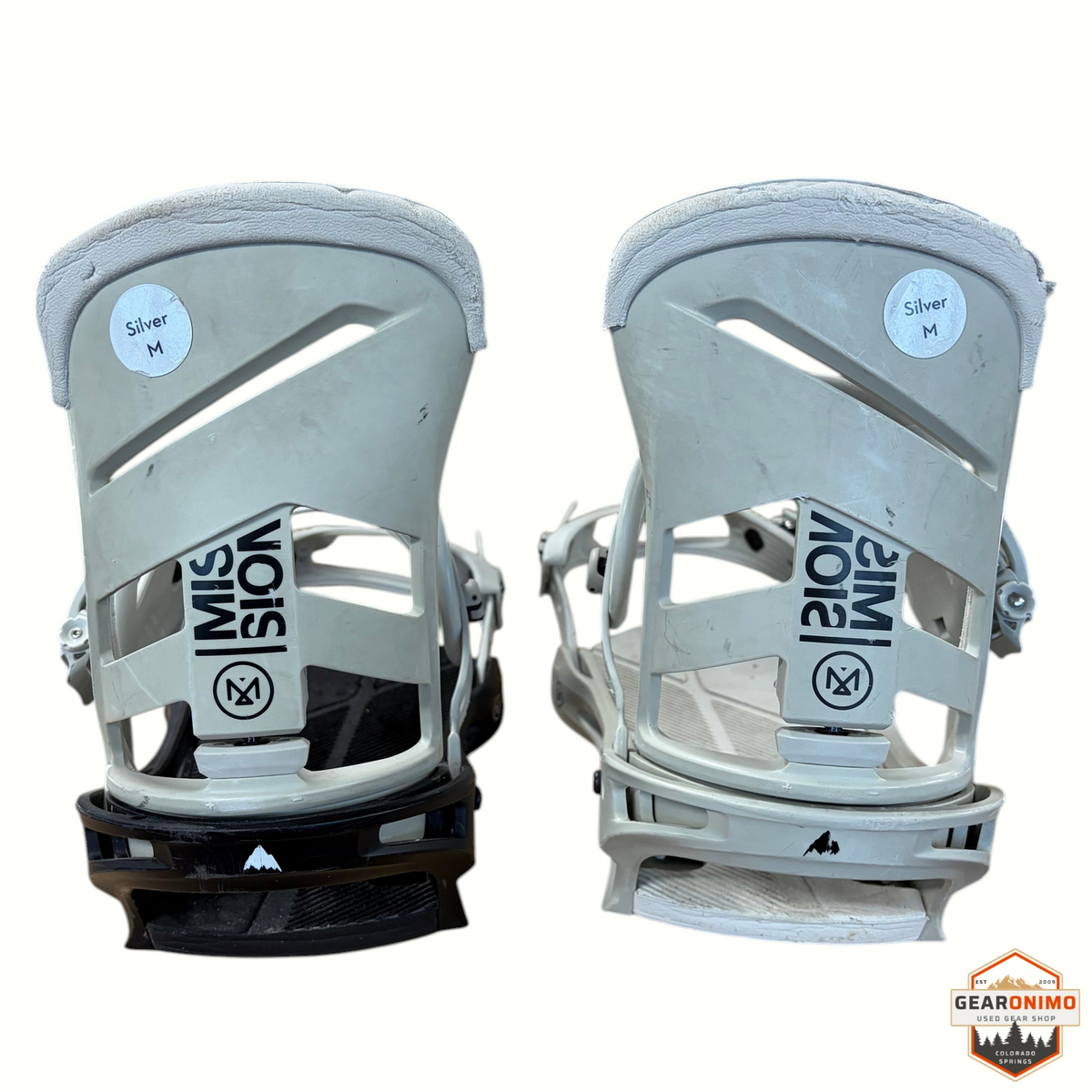 Gearonimo Sports Burton Mission snowboard bindings in silver and black, medium size, shown from the back.
