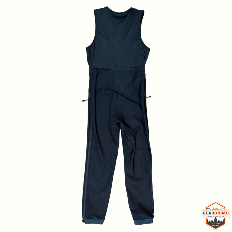 Gearonimo Sports Arc'teryx Gamma black softshell salopette with side zip closures laid flat on cardboard