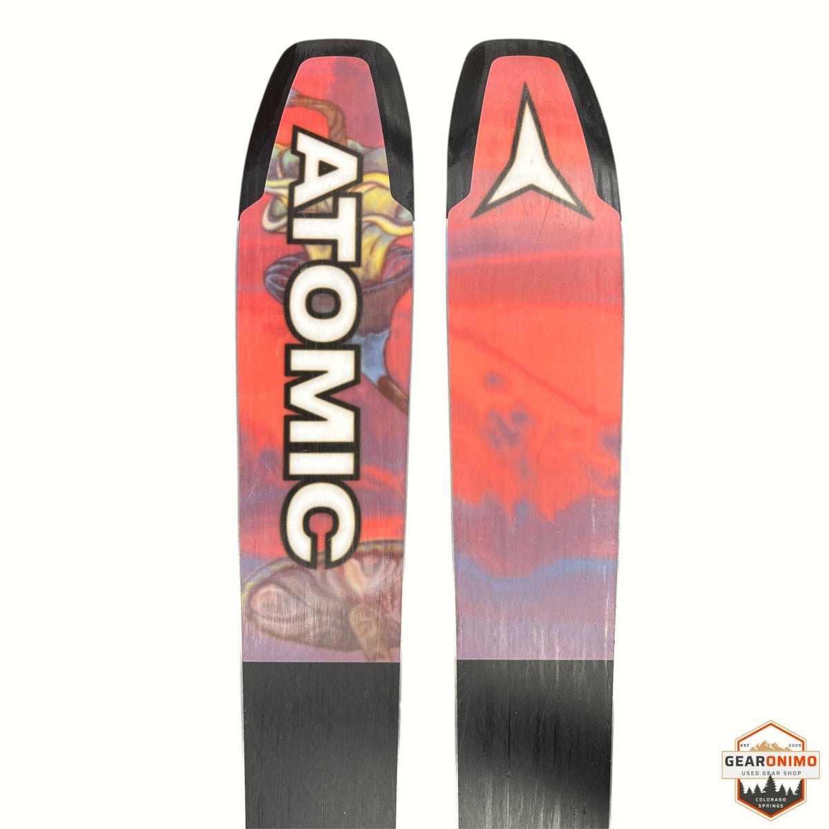 Gearonimo Sports Atomic Bent 100 skis featuring vibrant red and purple graphic topsheets with bold Atomic branding