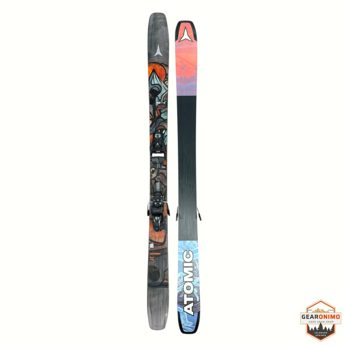 Gearonimo Sports Atomic Bent 100 skis featuring colorful graphic topsheet and black base with bindings