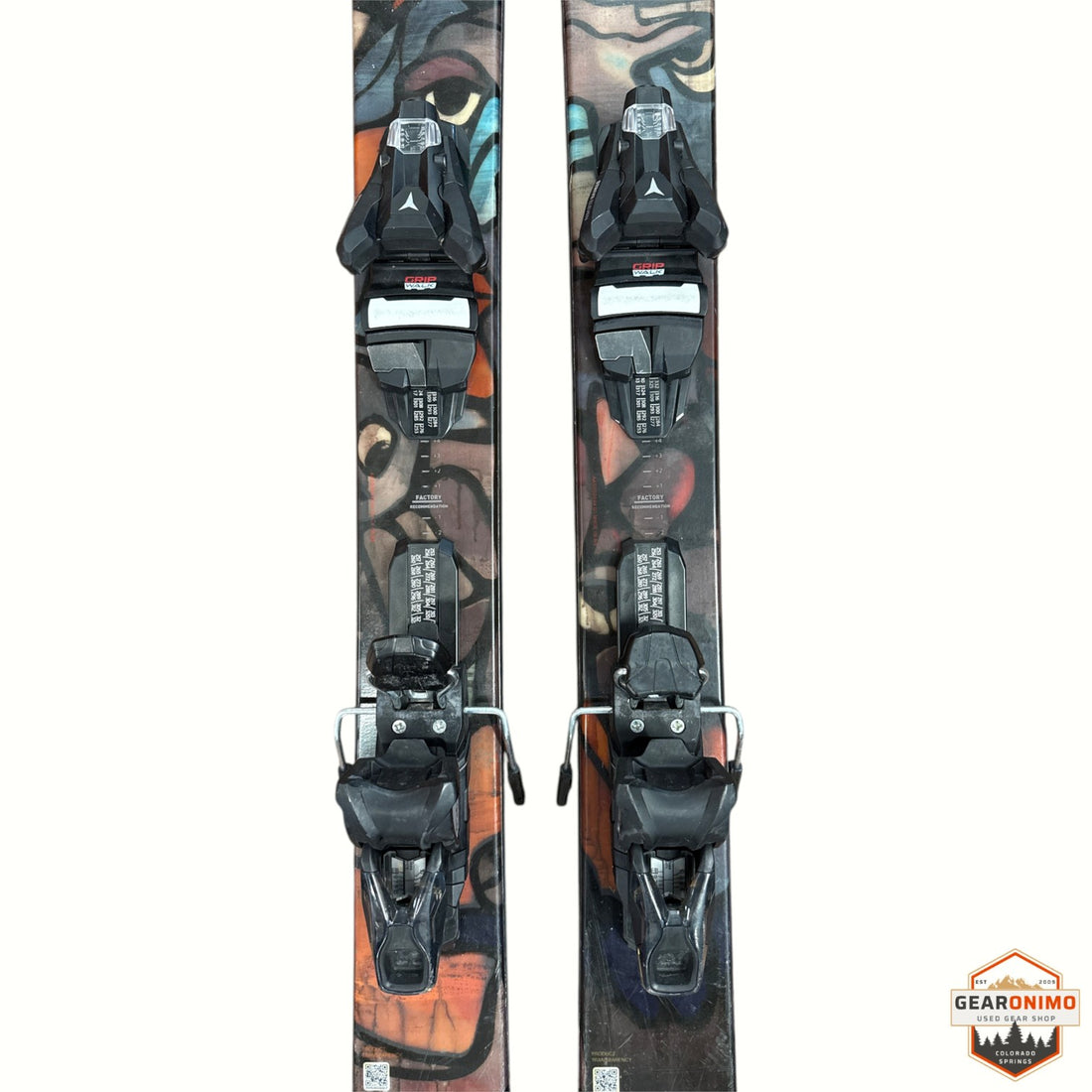Gearonimo Sports Atomic Bent 100 skis featuring colorful graphic topsheets and mounted black bindings