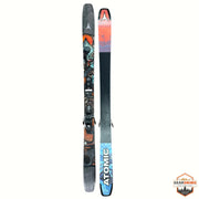 Gearonimo Sports Atomic Bent 100 skis featuring colorful graphic topsheets and black bases on a textured floor