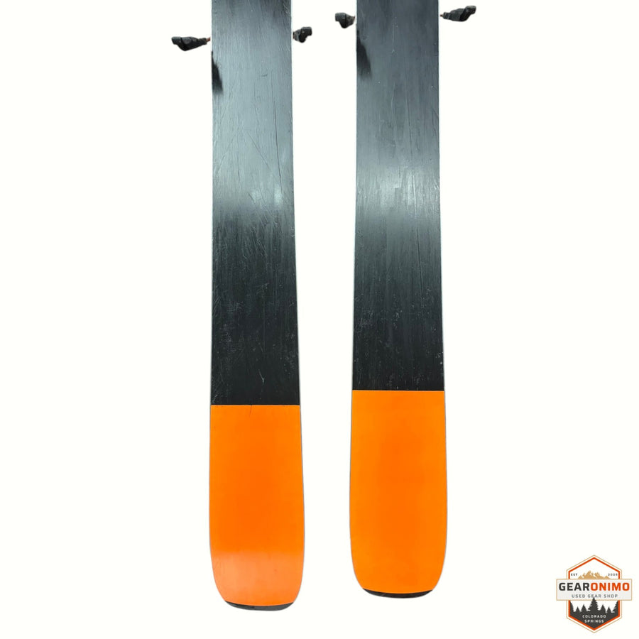 Gearonimo Sports Blizzard Anomaly 88 skis in black and orange, 176 cm length, showing base view