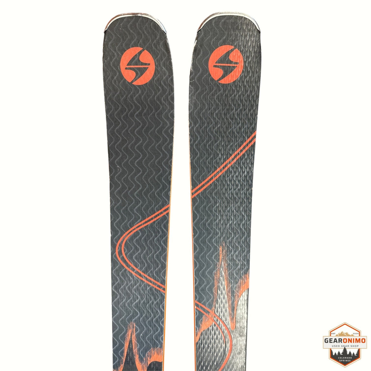 Gearonimo Sports Blizzard Anomany 88 skis with black and orange graphic topsheets and Marker TCX 11 bindings