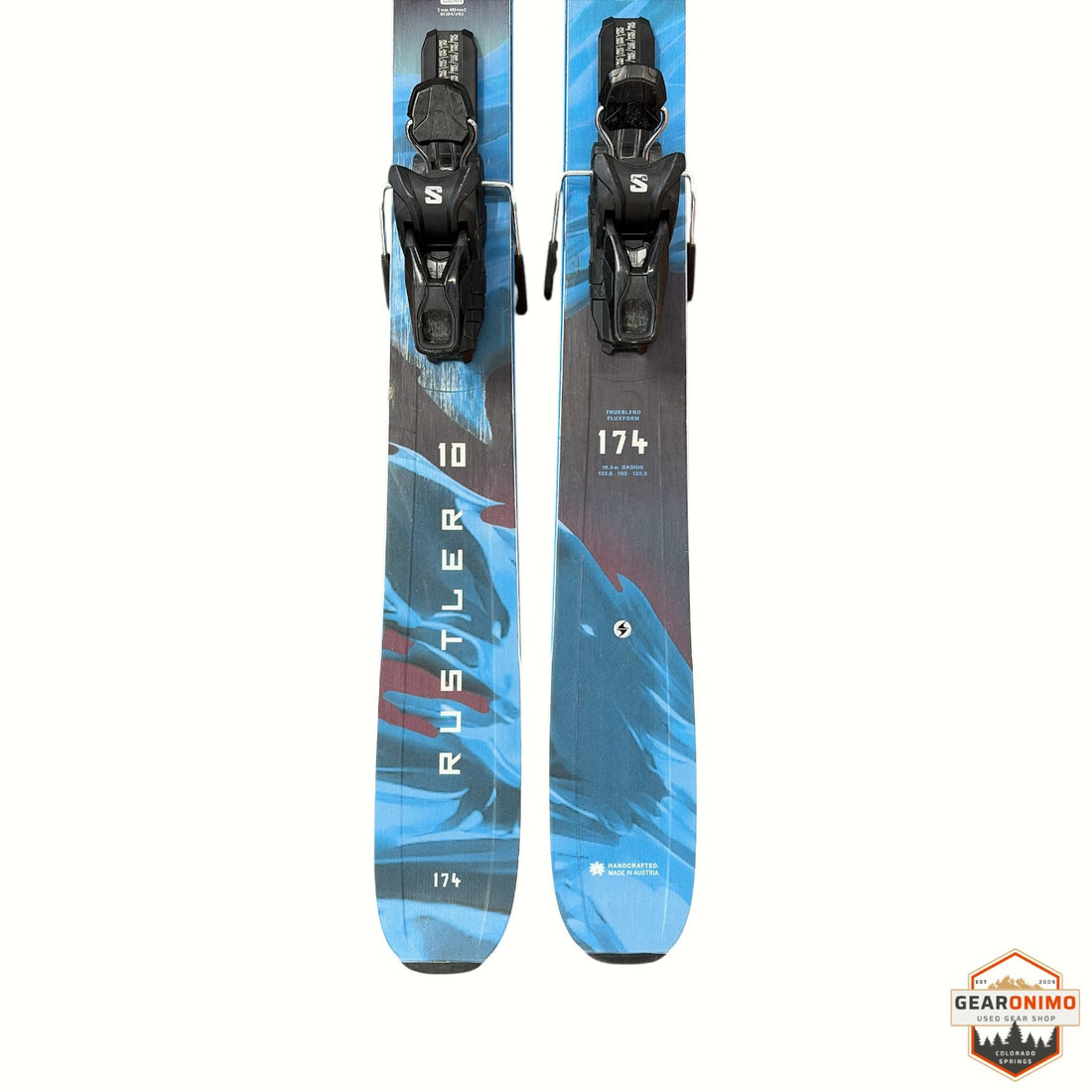 Gearonimo Sports Blizzard Rustler 10 skis in 174 cm length with blue and black graphic design and mounted bindings.