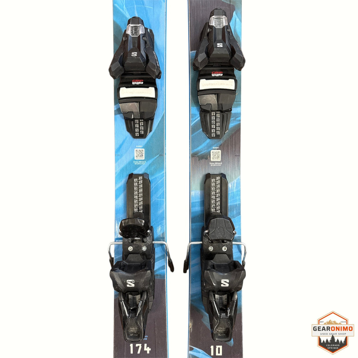 Gearonimo Sports Blizzard Rustler 10 skis in 174 cm length with black Salomon GripWalk bindings on a brown floor