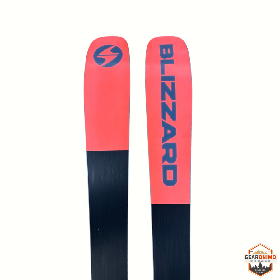 Gearonimo Sports Blizzard Sheeva 9 skis in coral and black with Blizzard branding on a cardboard background