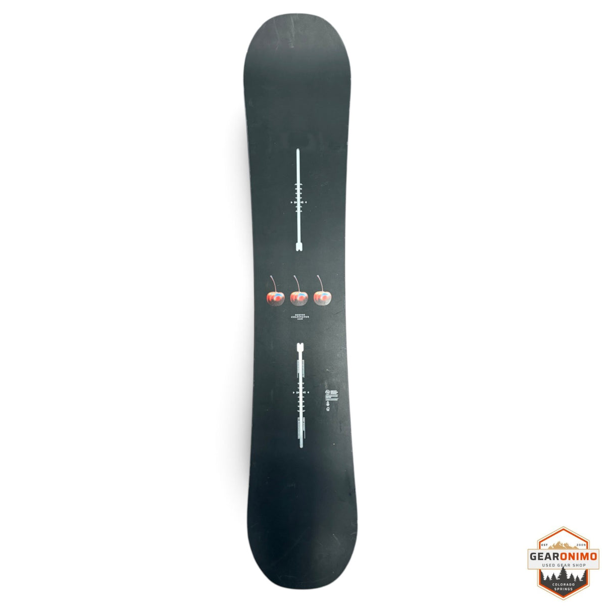 Gearonimo Sports Burton Cultivator snowboard in black with a cherry graphic design on a concrete floor