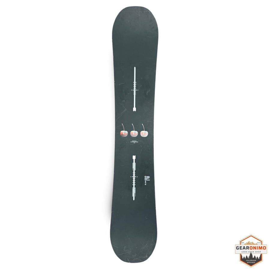 Gearonimo Sports Burton Cultivator snowboard in black with a cherry graphic design on a concrete floor