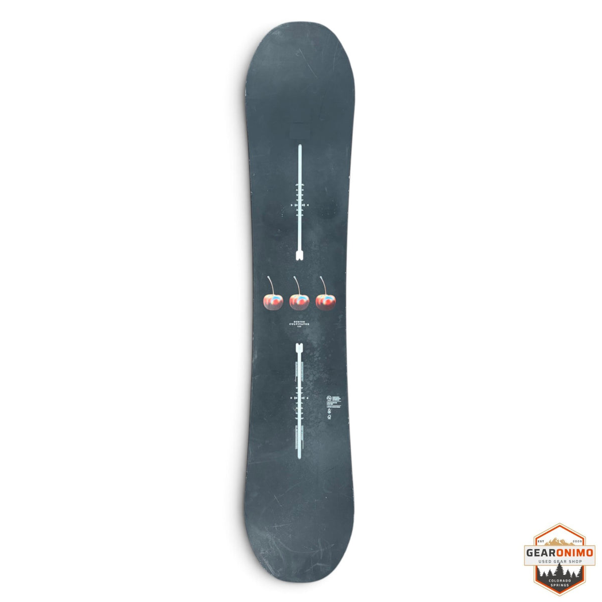 Gearonimo Sports Burton Cultivator snowboard in black with a central cherry graphic on a red concrete floor