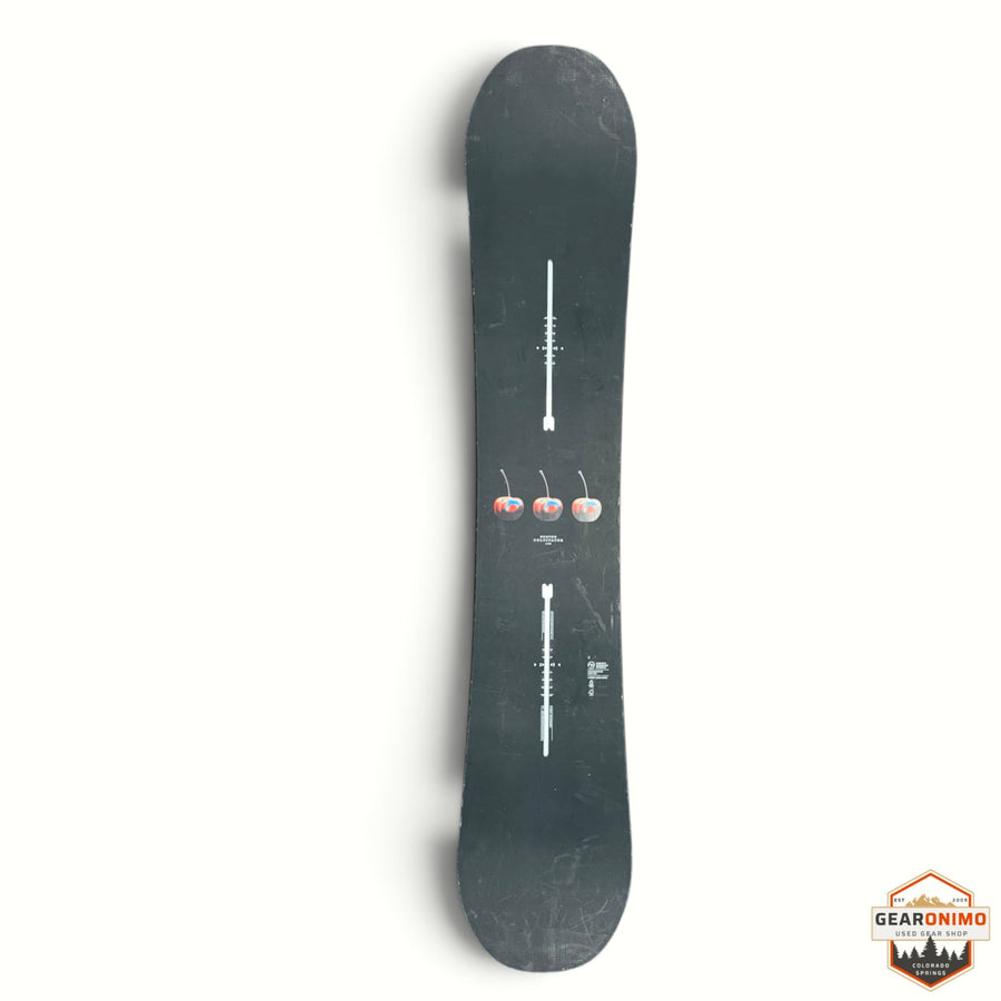 Gearonimo Sports Burton Cultivator snowboard in black with a central cherry graphic and white binding mounting details.