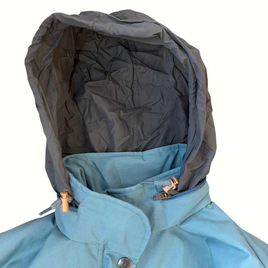 Gearonimo Sports Fjällräven jacket featuring a blue shell with a dark grey hood and tan toggle details.