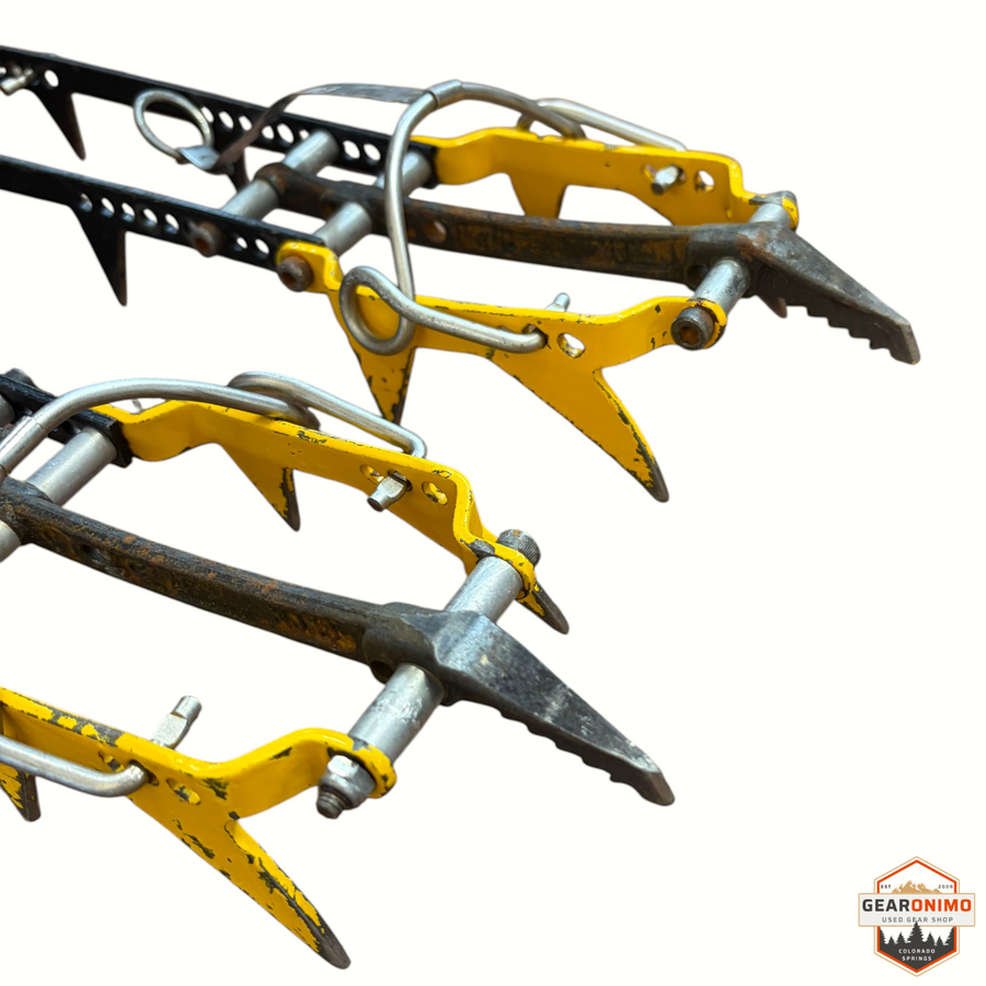 Gearonimo Sports Grivel mono crampons featuring yellow metal frames and sharp steel spikes for ice climbing