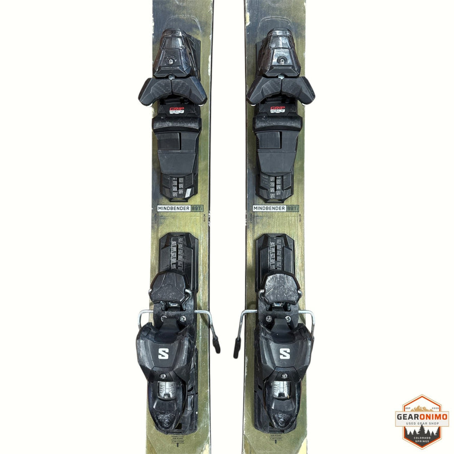 Gearonimo Sports K2 MindBender 89ti skis, 164 cm length, featuring mounted black bindings on a grey and gold surface.