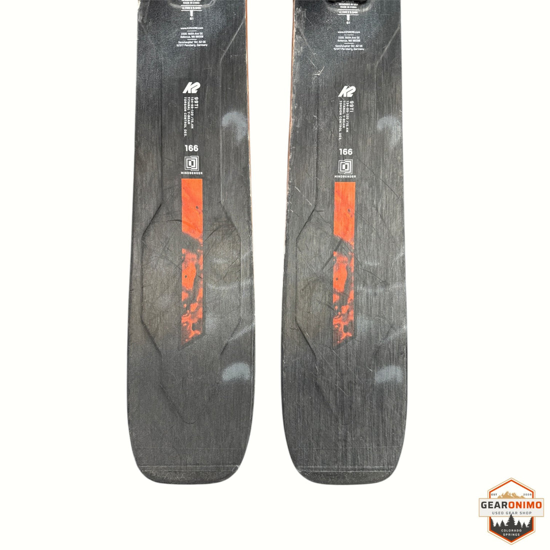 Gearonimo Sports K2 MindBender 99 Ti skis in black with orange graphic detail, 166 cm length, top sheet view