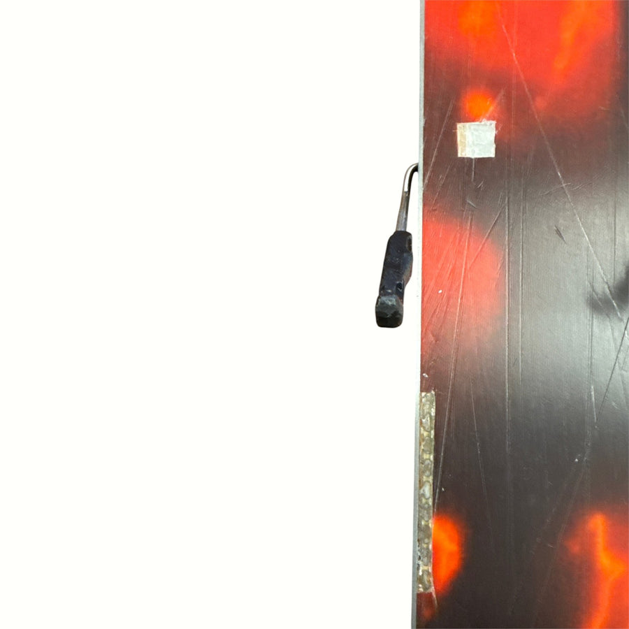 Gearonimo Sports K2 Mindbender 99TI ski base showing red and black graphic design and metal edge detail