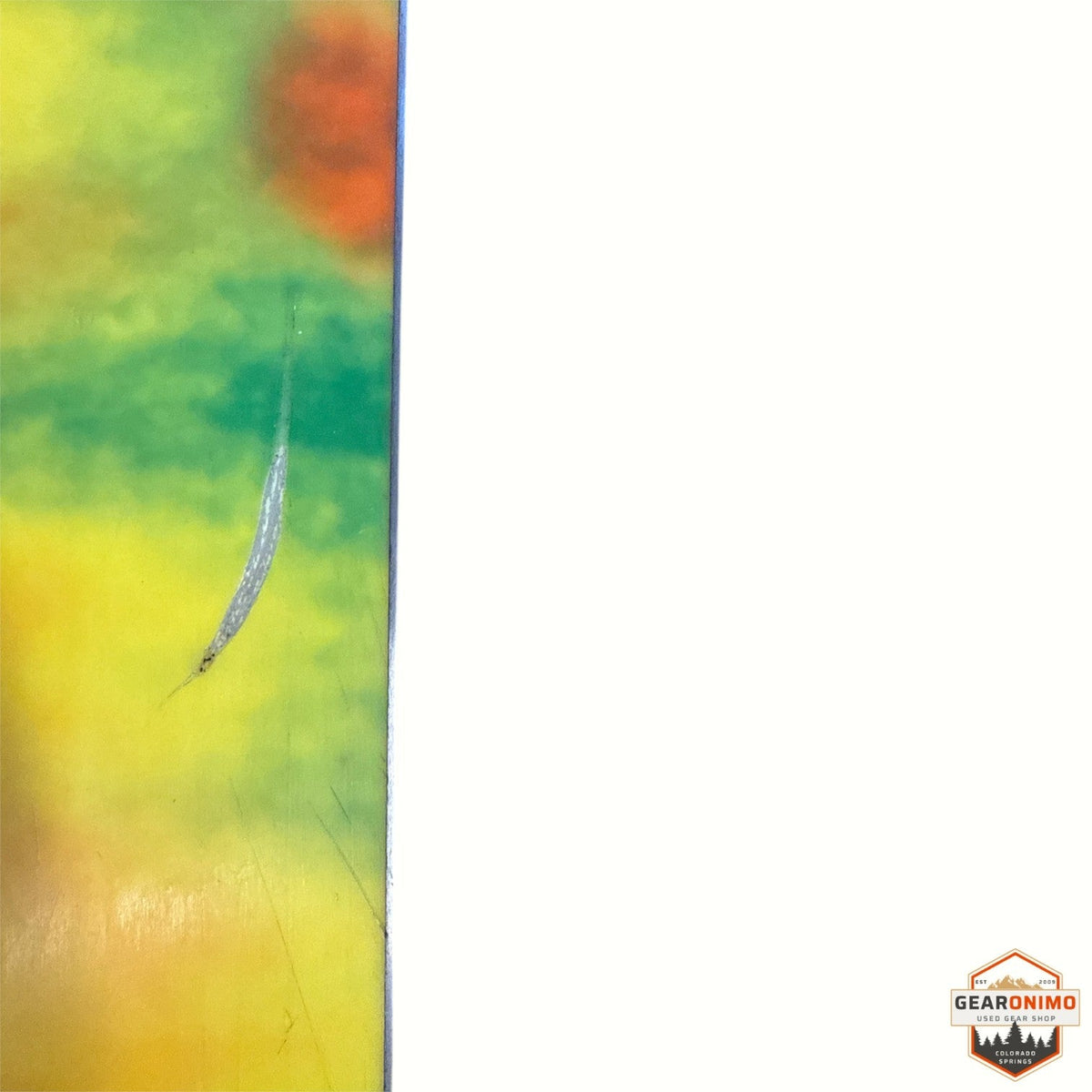 Gearonimo Sports K2 MindBender 89ti ski showing a vibrant yellow and green topsheet with a minor surface scratch.