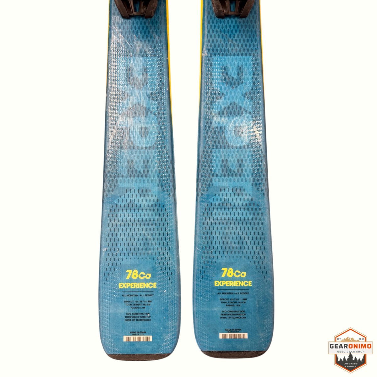 Gearonimo Sports Rossignol E78 Ca skis with blue topsheets and yellow branding, showing technical specifications.
