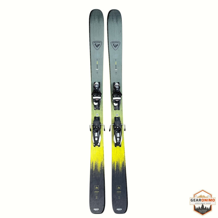 Gearonimo Sports Rossignol Sender Soul 102 skis in olive green and yellow with mounted bindings, top-down view.