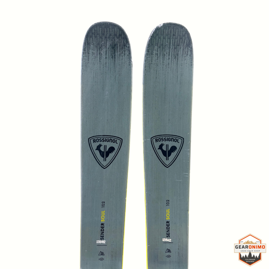 Gearonimo Sports Rossignol Sender Soul 102 skis in grey with black rooster logo and Look Nx 12 bindings