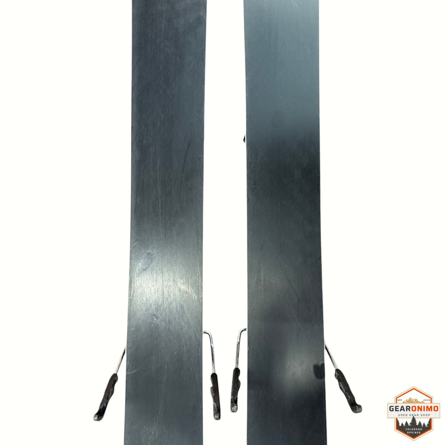 Gearonimo Sports Salomon QST 92 skis featuring black bases and metal edges, shown from a top-down perspective.