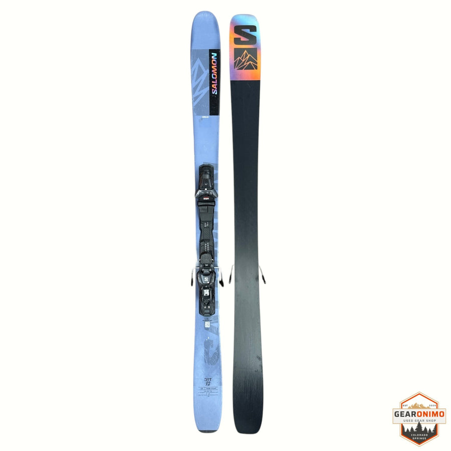Gearonimo Sports Salomon QST 92 skis in light blue with black bindings and a colorful mountain graphic on the tips