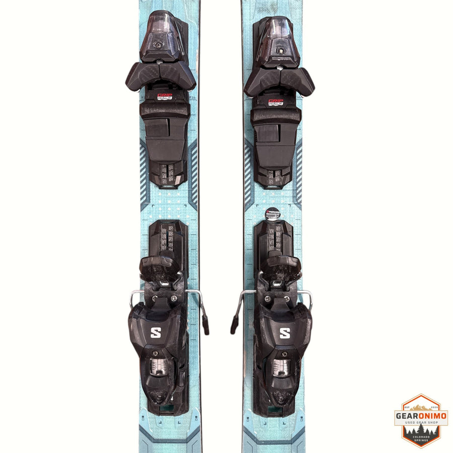 Gearonimo Sports Volkl Mantra 88 skis in light blue with black GripWalk bindings, top-down view.