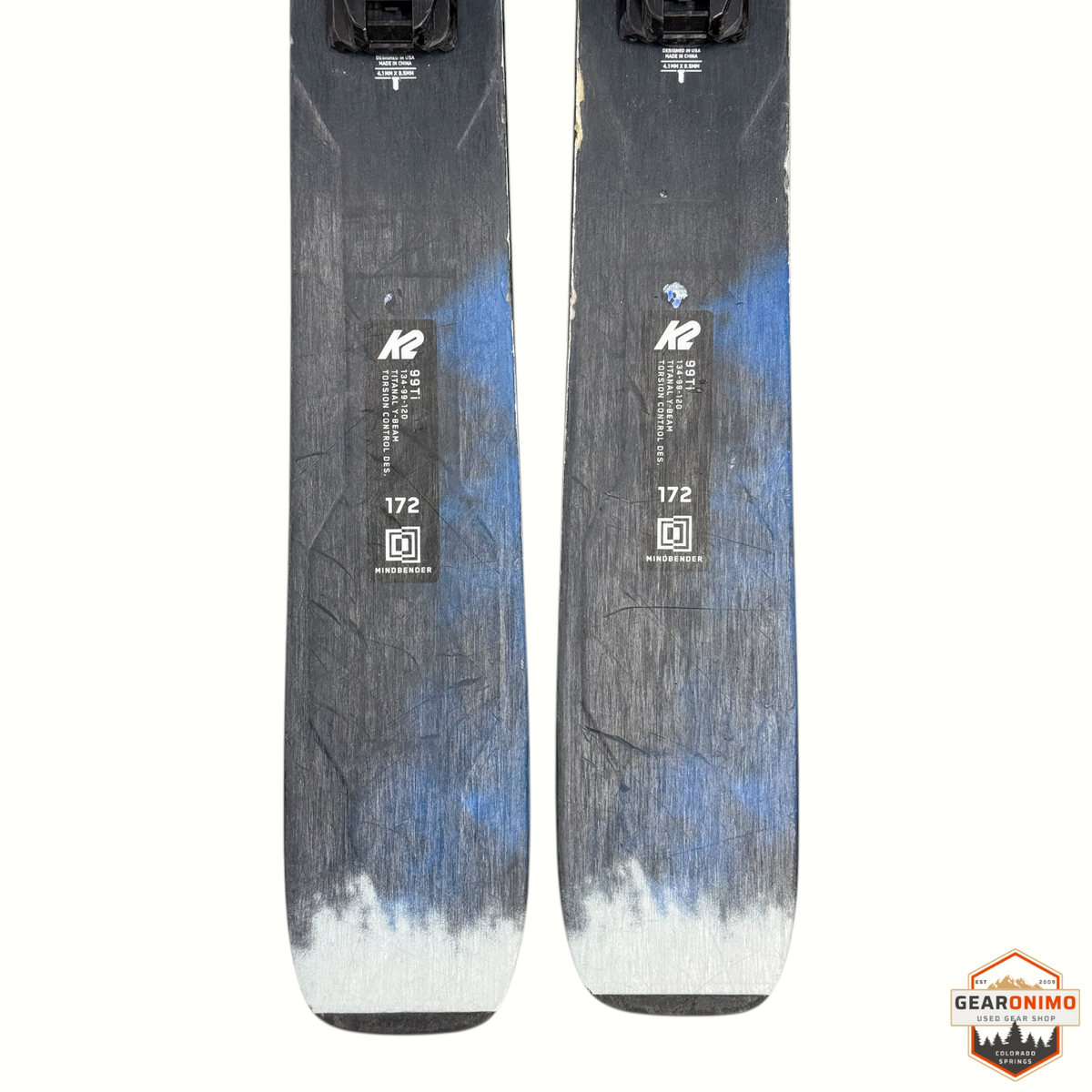 Gearonimo Sports K2 Mindbender 99ti 172cm skis with Salomon M11 bindings featuring black and blue graphic topsheets.