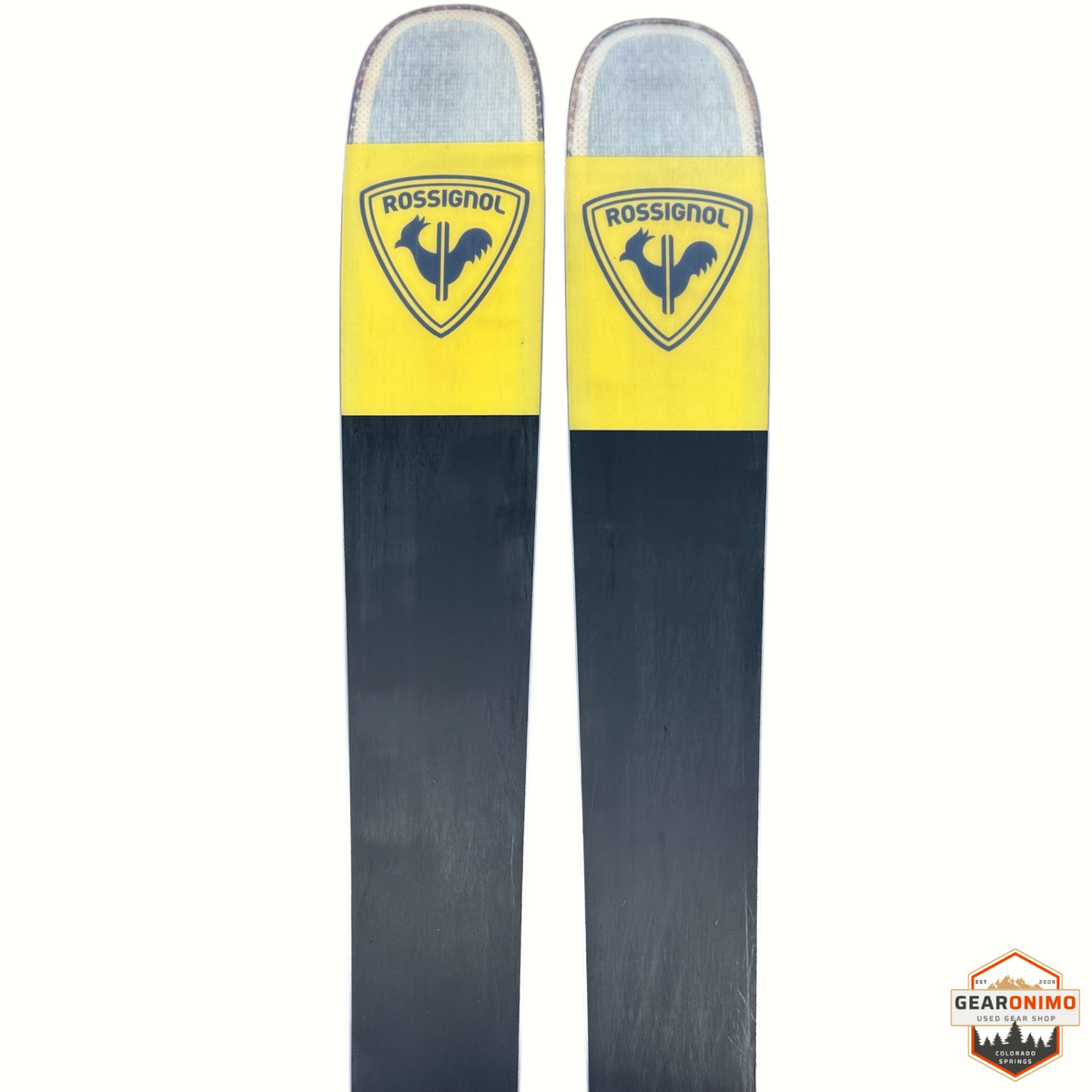 Gearonimo Sports Rossignol Sender Soul 102 skis with yellow and black tips, 180cm length, top-down view.