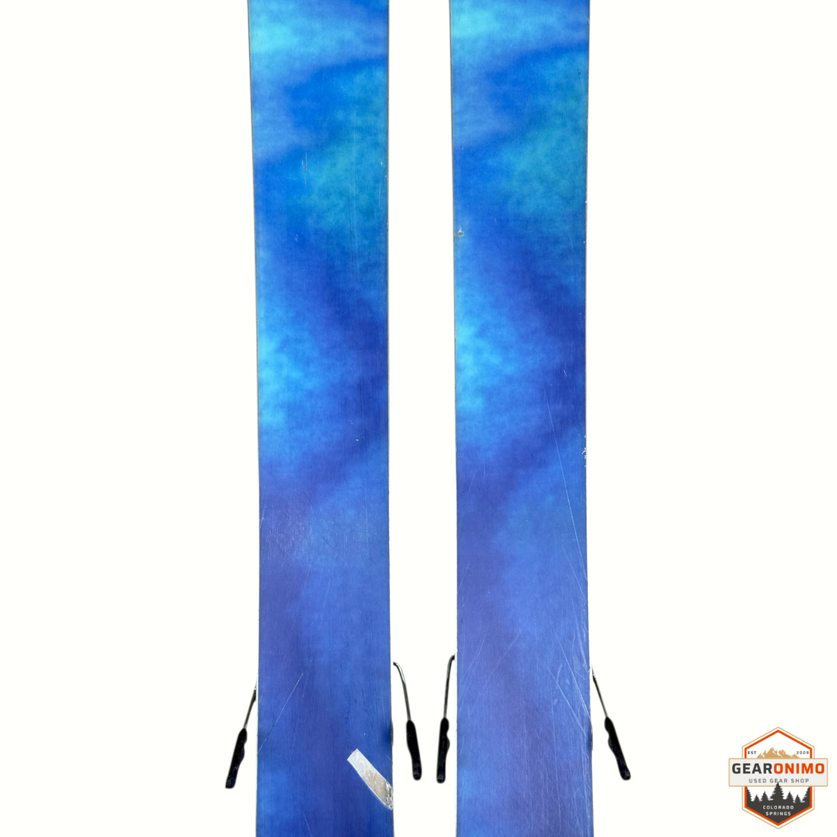 Gearonimo Sports K2 Mindbender 99ti skis with blue watercolor-style graphic topsheets and Salomon M11 bindings