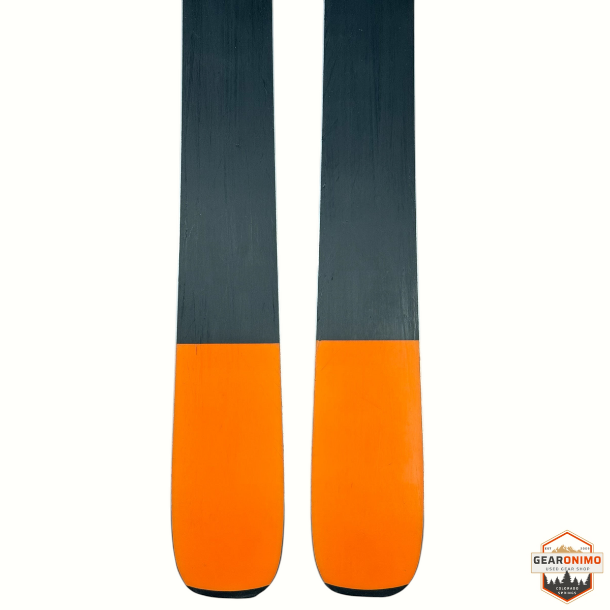 Gearonimo Sports Blizzard Anomaly 88 skis with black and bright orange tips, shown from a top-down view.