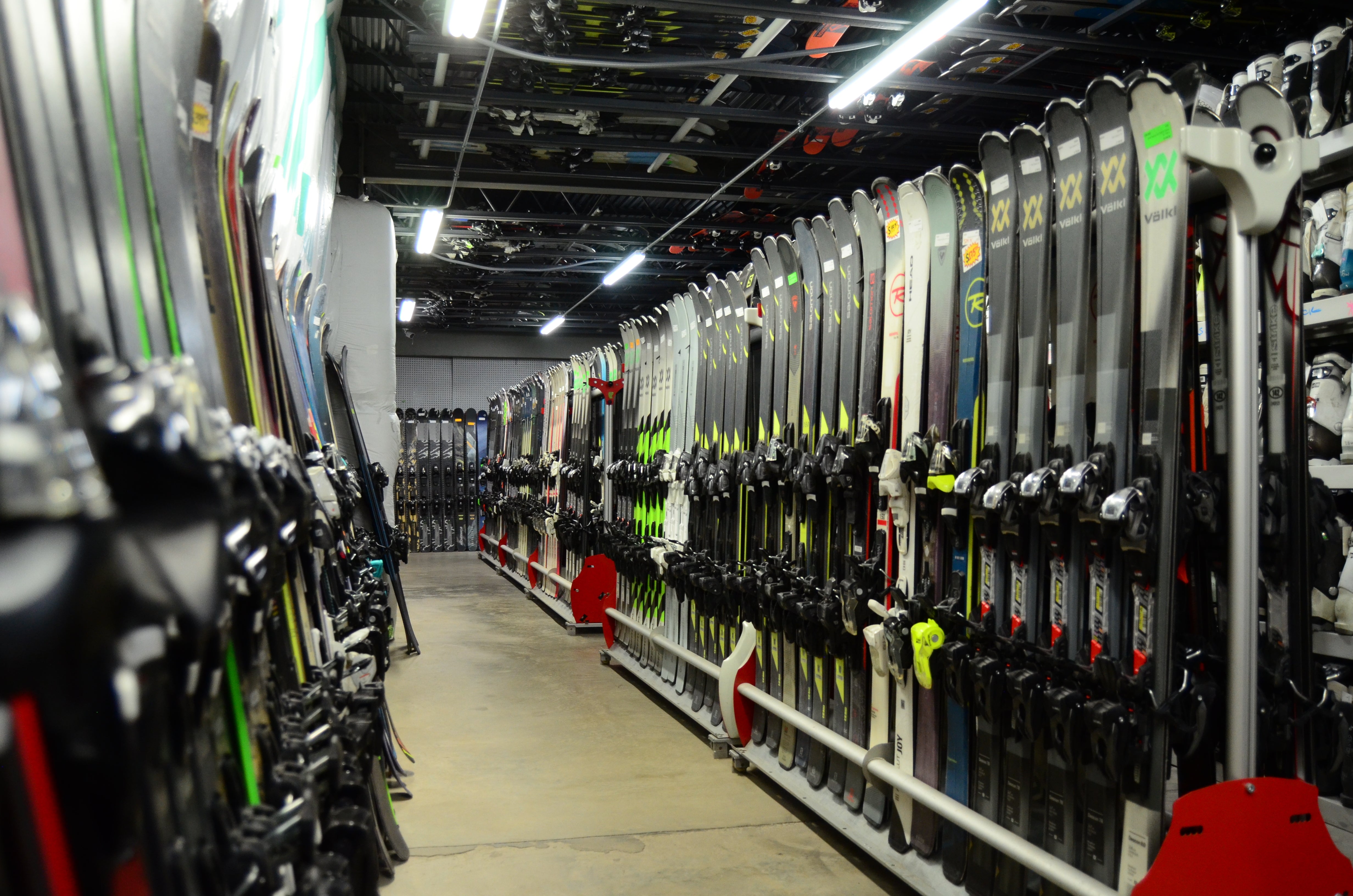 Ski and snowboard gear wall at Gearonimo Sports in Colorado Springs